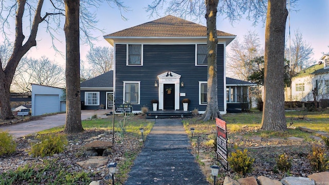 view of front of property with an outbuilding and a garage