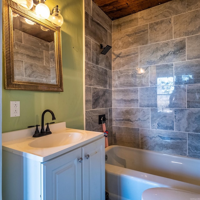 bathroom featuring vanity and tiled shower / bath combo