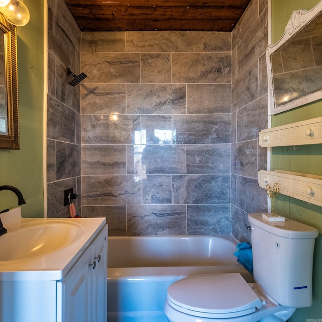 full bathroom featuring vanity, toilet, and tiled shower / bath