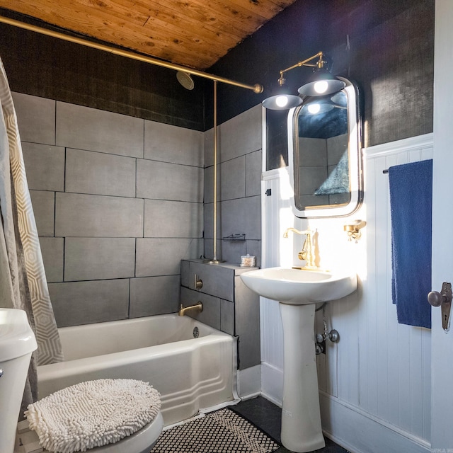 bathroom featuring toilet, tile patterned flooring, shower / tub combo with curtain, and wooden ceiling