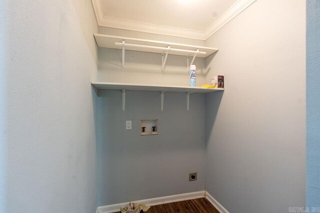 washroom featuring hookup for a washing machine, baseboards, hookup for an electric dryer, dark wood-type flooring, and crown molding