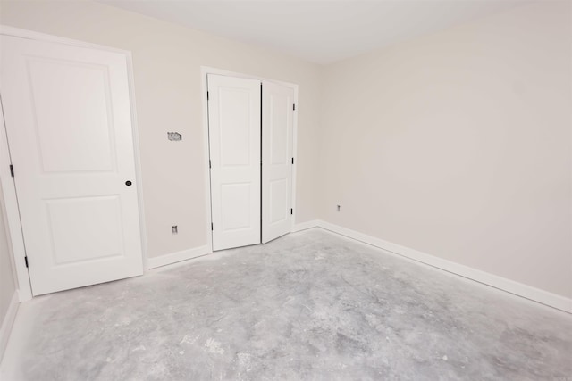 unfurnished bedroom with a closet