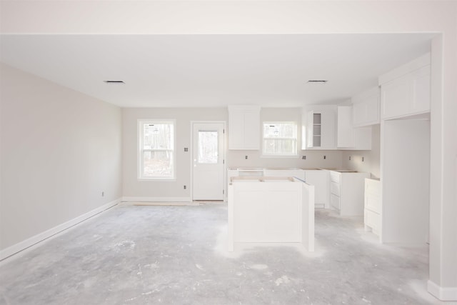 kitchen with white cabinetry and a kitchen island