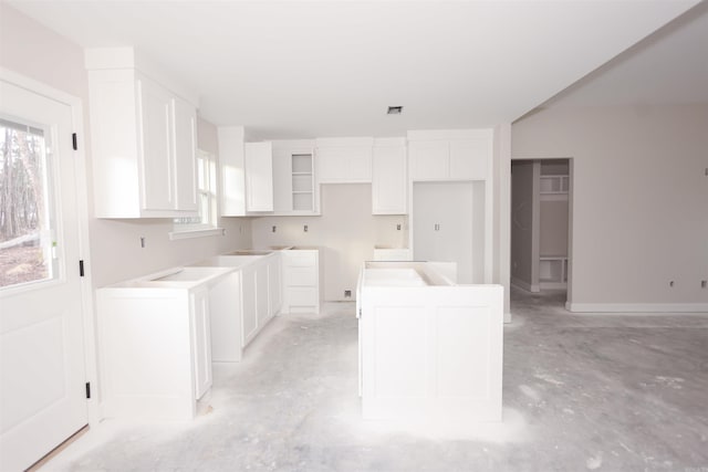 kitchen featuring white cabinets and plenty of natural light