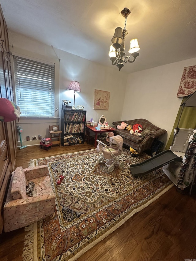 bedroom with hardwood / wood-style flooring and a chandelier