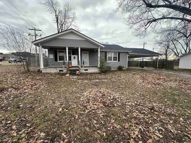 view of front facade featuring a carport and covered porch