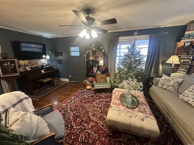 living room with ceiling fan, dark wood-type flooring, and ornamental molding