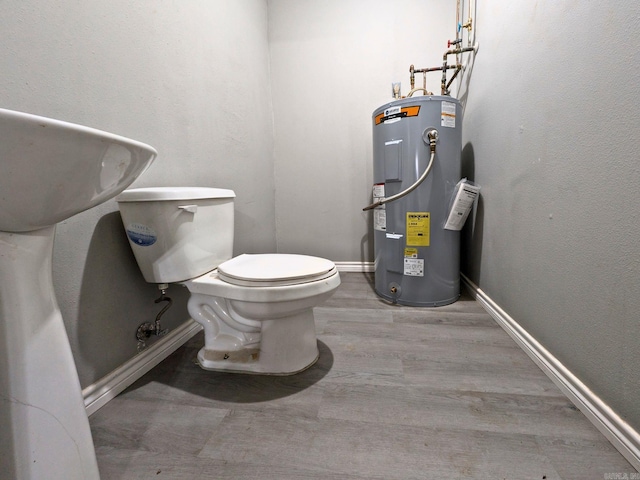 bathroom featuring water heater and toilet