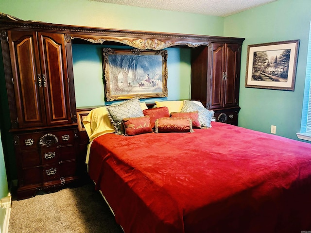 carpeted bedroom featuring a textured ceiling