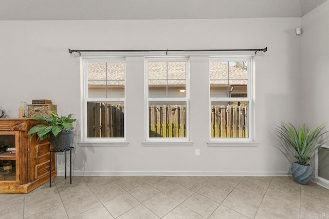 spare room with light tile patterned floors