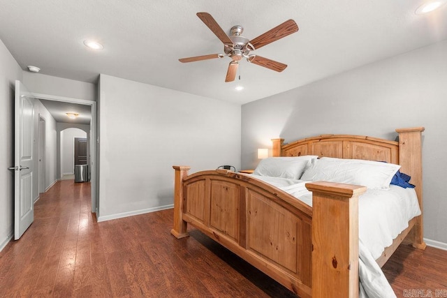 bedroom with ceiling fan and dark wood-type flooring