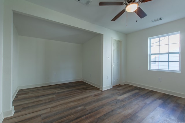 unfurnished bedroom with ceiling fan, dark hardwood / wood-style floors, and a closet