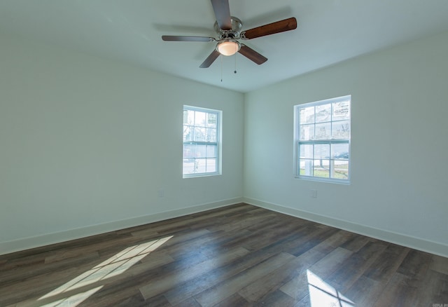 unfurnished room featuring ceiling fan, dark hardwood / wood-style flooring, and a healthy amount of sunlight