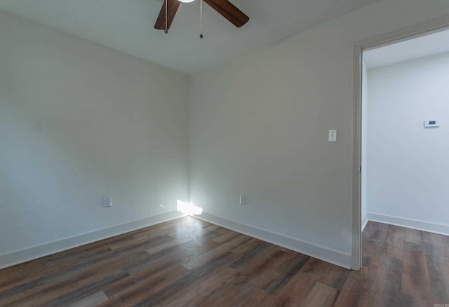 unfurnished room with ceiling fan and dark hardwood / wood-style flooring