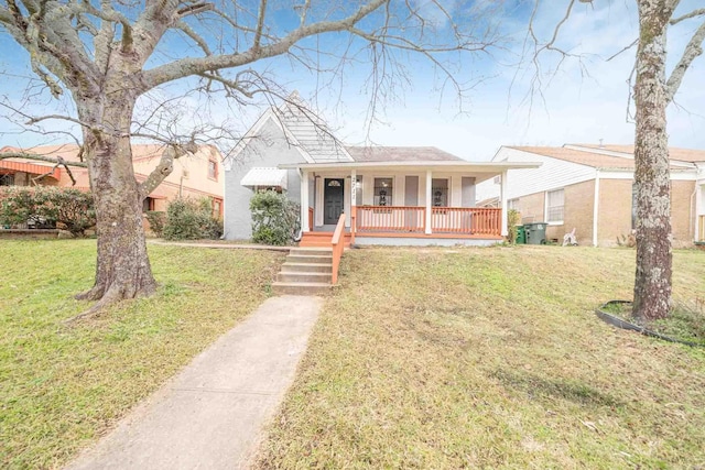 view of front facade featuring covered porch and a front yard