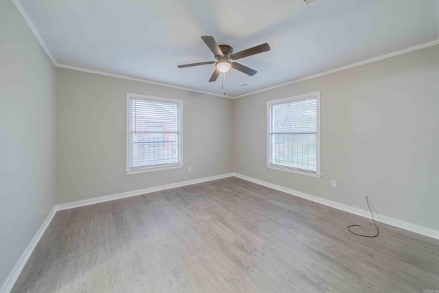 unfurnished room with hardwood / wood-style floors, ceiling fan, and ornamental molding