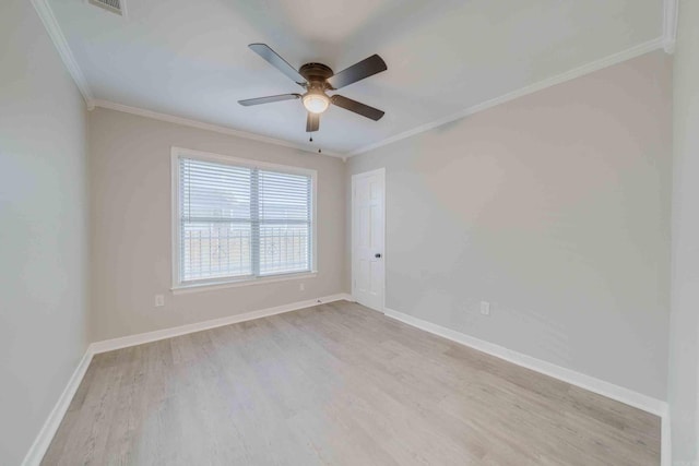 spare room featuring light wood-type flooring, ceiling fan, and ornamental molding