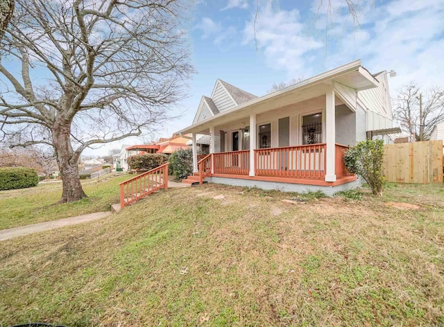 exterior space with a front lawn and covered porch