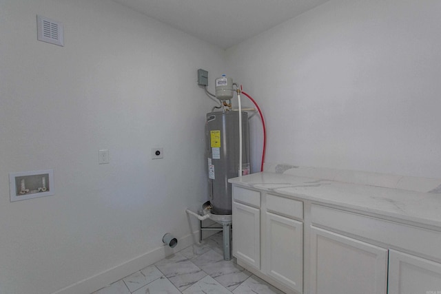 clothes washing area with washer hookup, electric dryer hookup, cabinets, and water heater