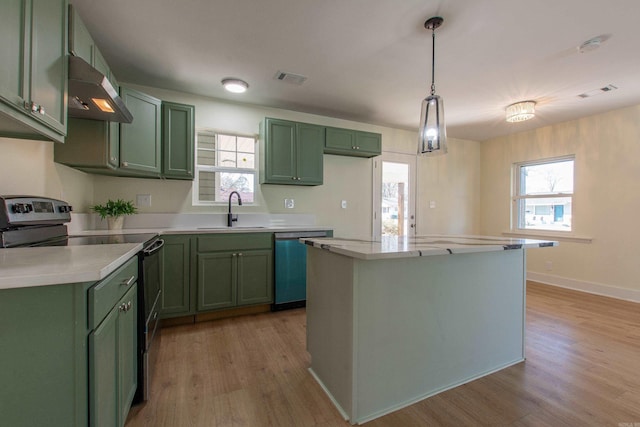 kitchen with black range with electric stovetop, sink, green cabinetry, stainless steel dishwasher, and light wood-type flooring