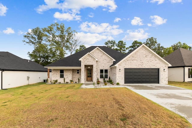 view of front facade featuring a front lawn and a garage