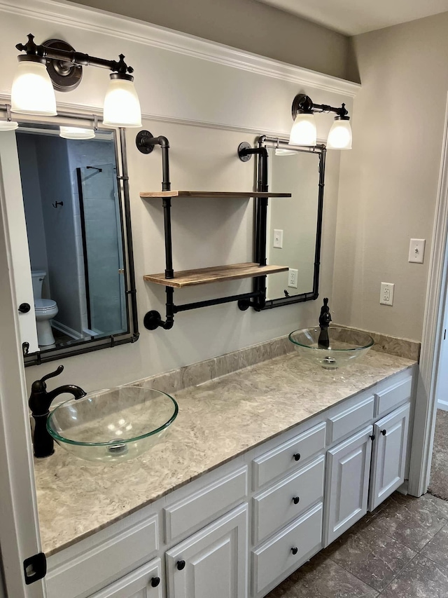 bathroom with vanity and toilet