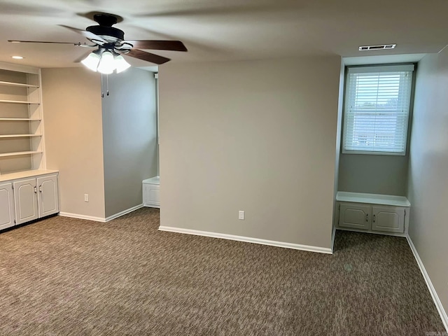 carpeted empty room featuring ceiling fan