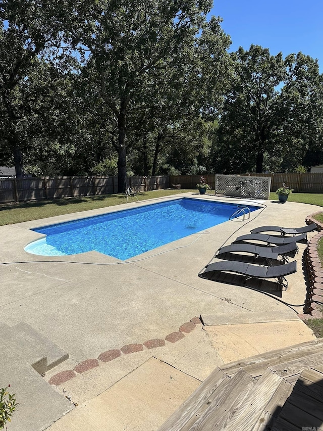 view of swimming pool with a patio area