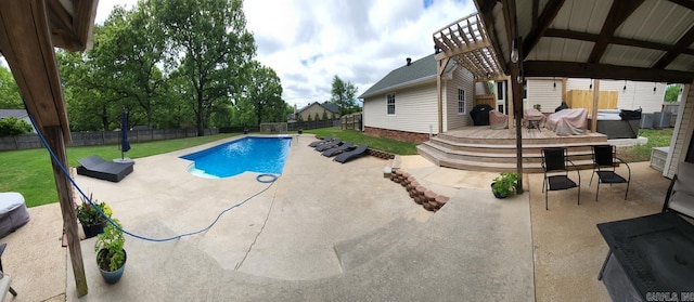 view of pool with a lawn and a patio area