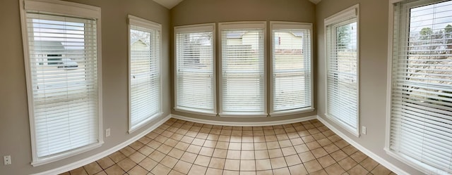 unfurnished sunroom with vaulted ceiling