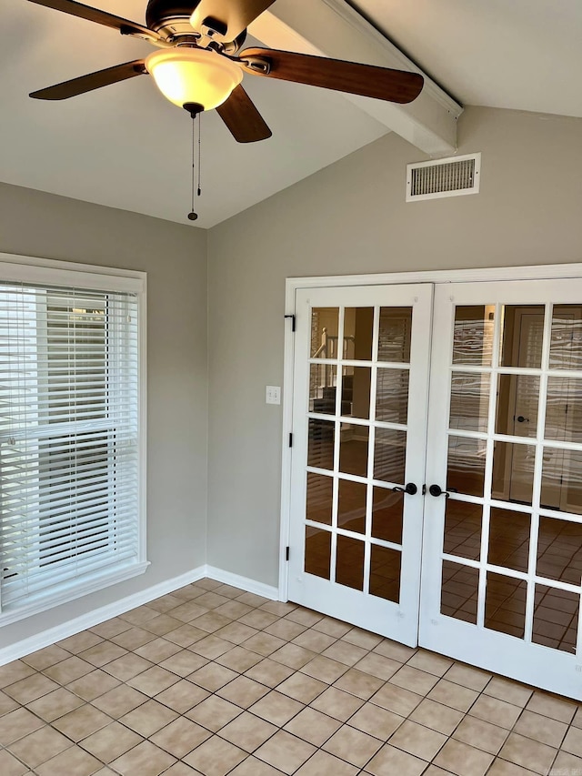 unfurnished sunroom with french doors, vaulted ceiling with beams, and ceiling fan