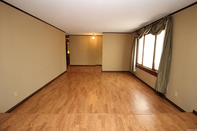 spare room featuring light hardwood / wood-style flooring