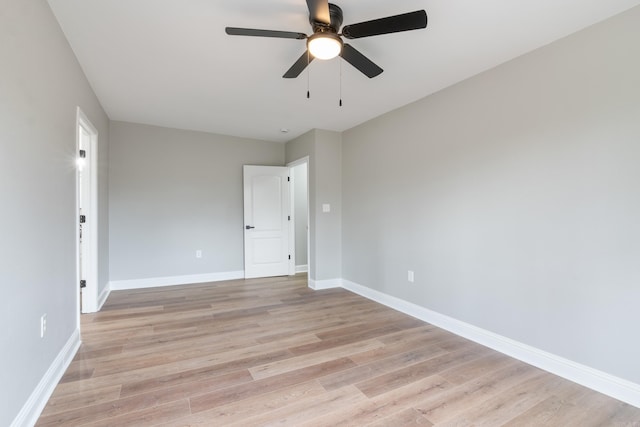 empty room with light wood-type flooring and ceiling fan