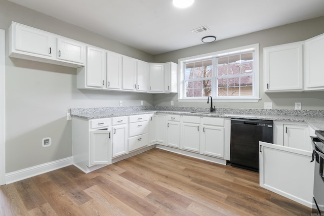 kitchen with dishwasher, white cabinets, light hardwood / wood-style flooring, and sink