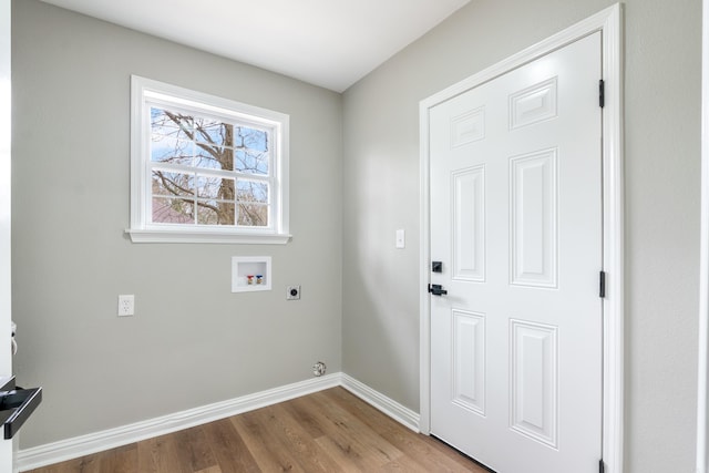 washroom with hookup for a washing machine, hardwood / wood-style floors, and hookup for an electric dryer