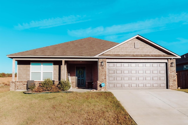 ranch-style home with a garage and a front lawn