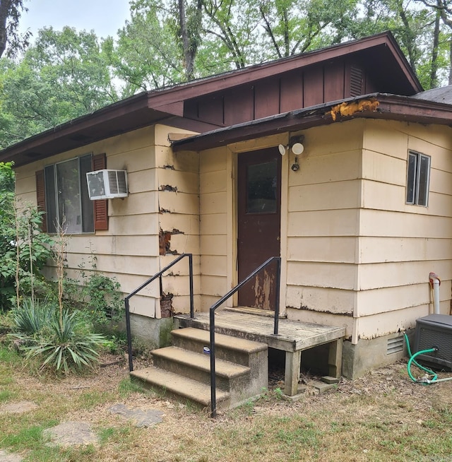 entrance to property with a wall mounted air conditioner