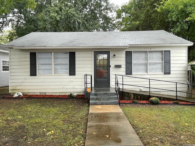 view of front of home with a front lawn