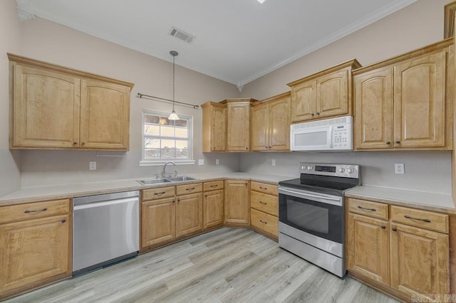 kitchen with sink, crown molding, decorative light fixtures, appliances with stainless steel finishes, and light wood-type flooring