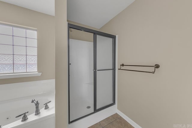 bathroom with tile patterned flooring and plus walk in shower