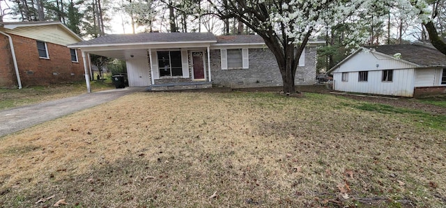 view of front of house with a front lawn and a carport