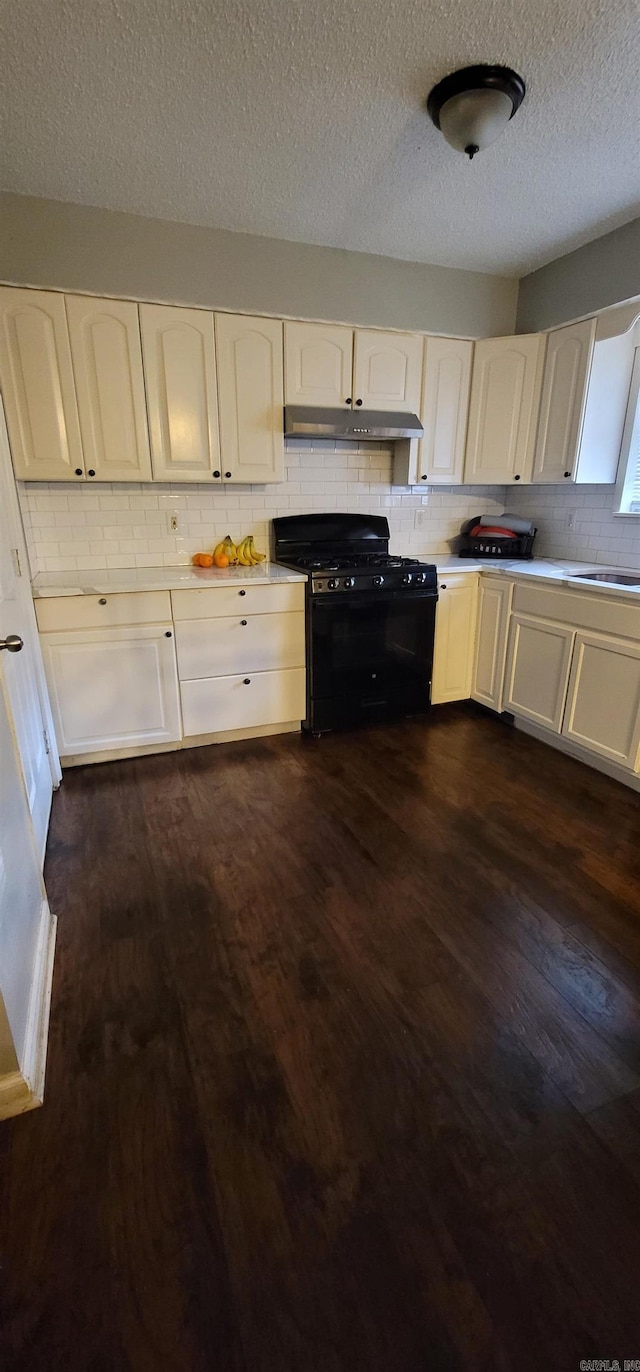 kitchen with white cabinets, black range with gas cooktop, dark hardwood / wood-style floors, and a textured ceiling