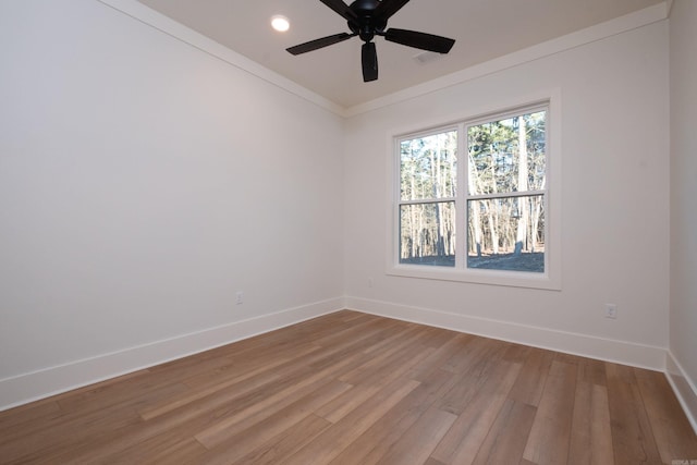 unfurnished room featuring ornamental molding, wood-type flooring, and ceiling fan