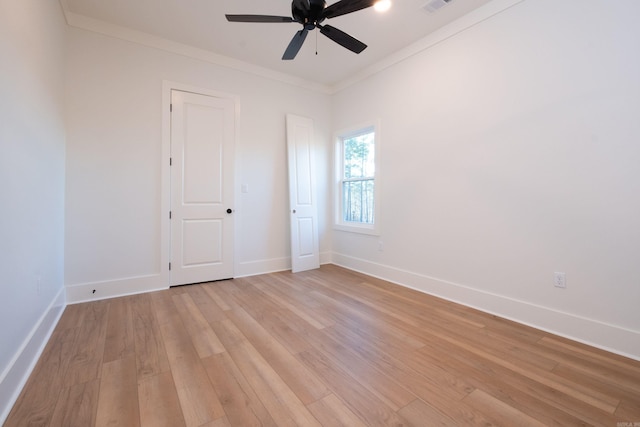 unfurnished room featuring crown molding, ceiling fan, and light wood-type flooring