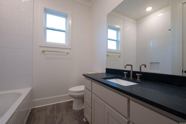 bathroom featuring vanity and toilet