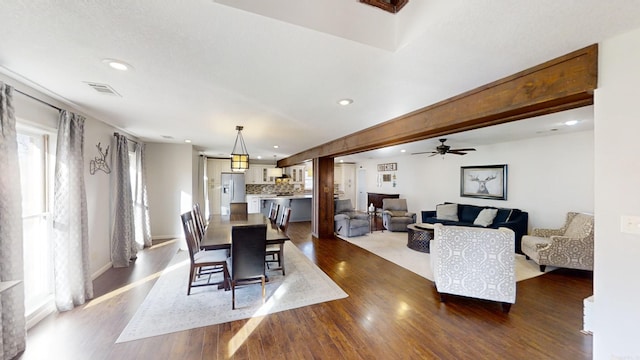 dining area with hardwood / wood-style floors and ceiling fan