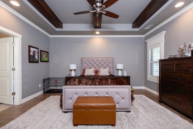 bedroom featuring ornamental molding, ceiling fan, and dark wood-type flooring