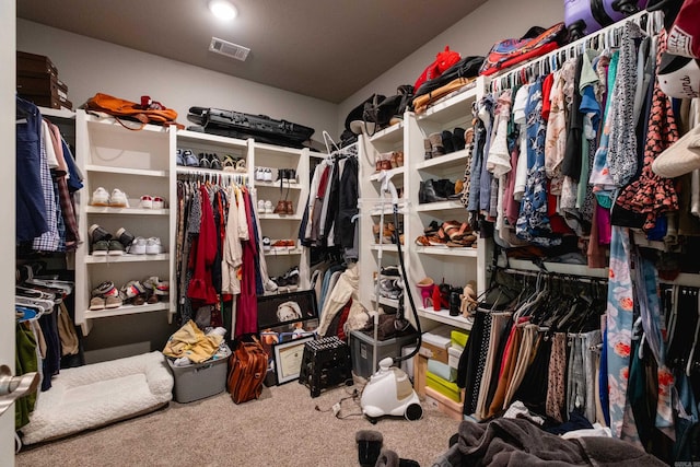 walk in closet featuring carpet