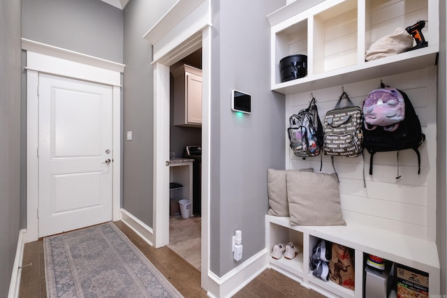 mudroom with dark wood-type flooring