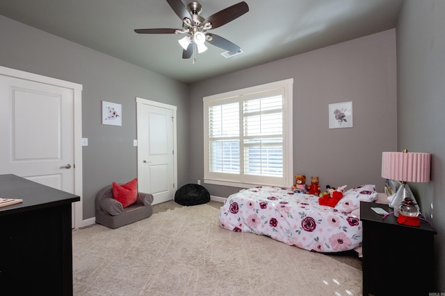 bedroom with light carpet and ceiling fan